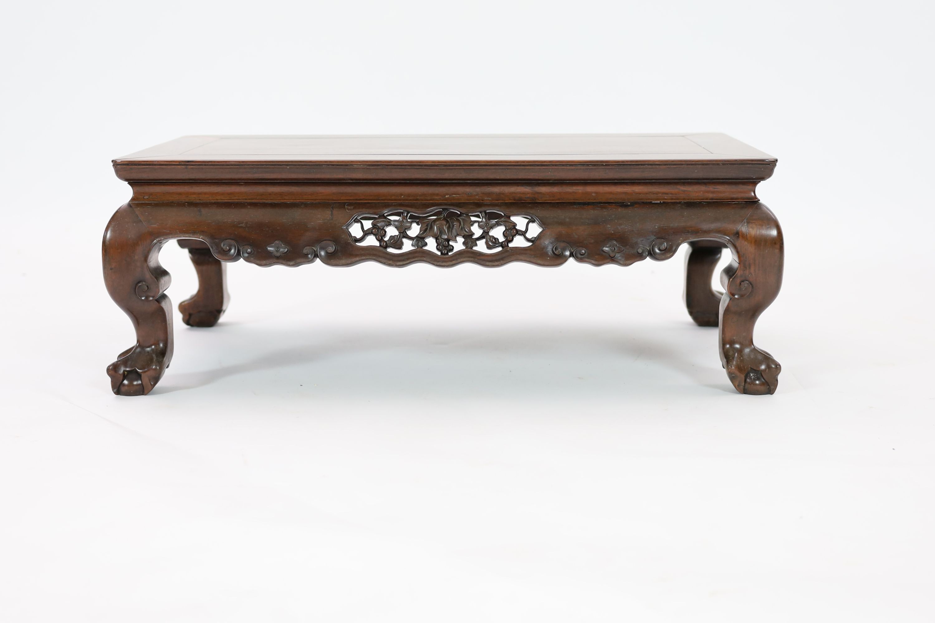 A Chinese hongmu Kang table, 19th century, 79 cm long, 43 cm wide, 27 cm high, old repairs